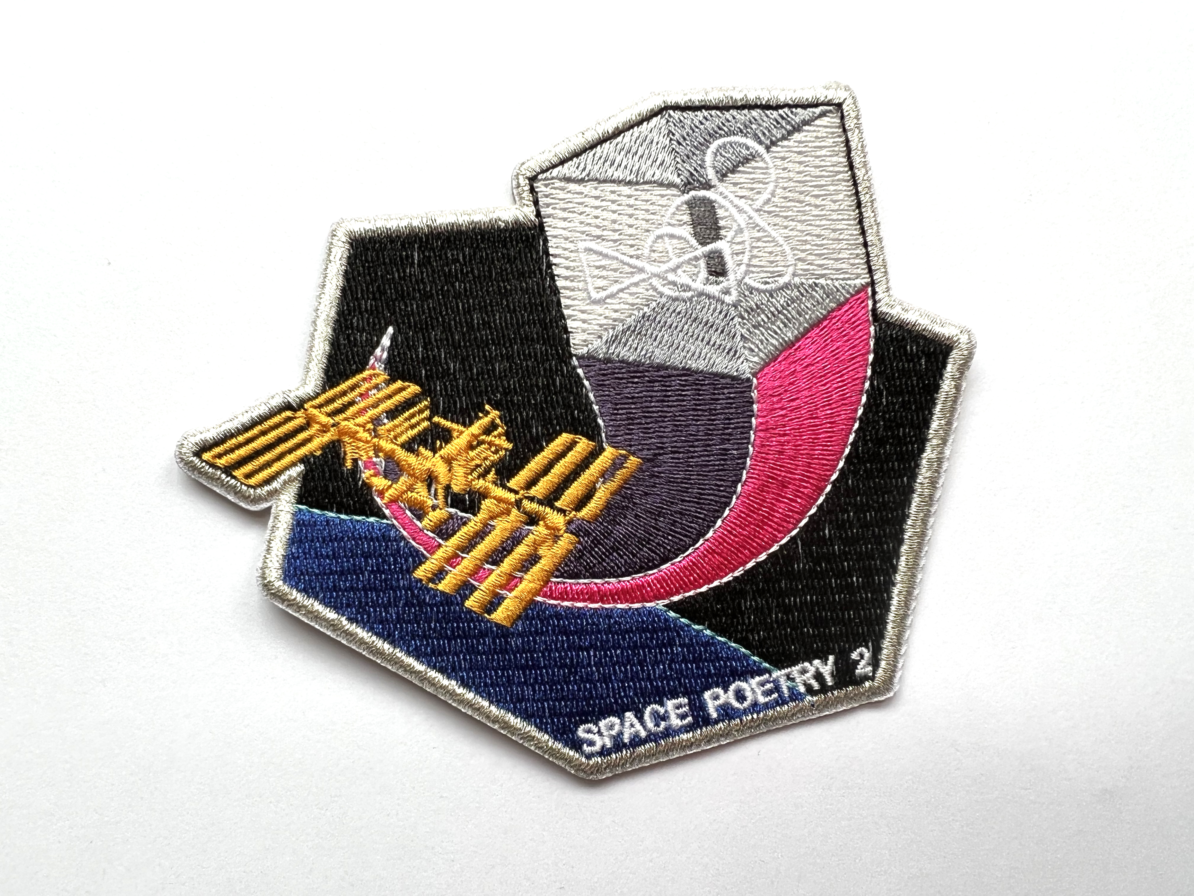 Eduardo Kac, Space Poetry 2, 12-color embroidered patch